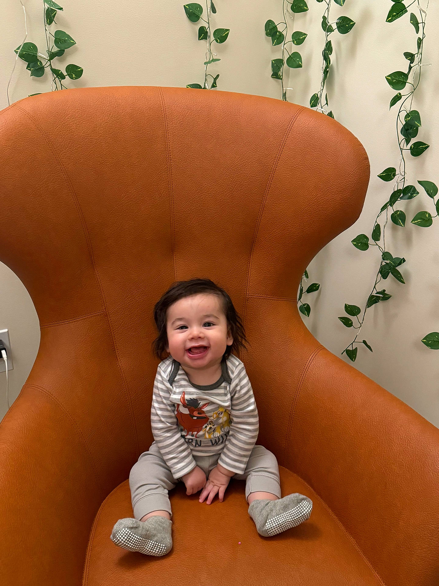 Cheveyo is registered to the contest to win money with this photo: armchair, baby, bodypart, chair, clothing, couch, cushion, face, finger, furniture, hand, happy, head, hosiery, pants, person, photography, portrait, sitting, sock