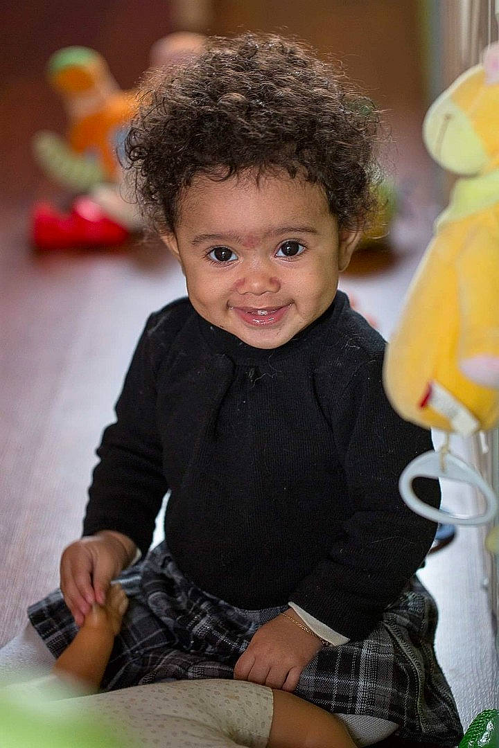 Marley participe au concours pour gagner de l'argent avec cette photo : afro, baby_products, baby_toddler_clothing, baby_toys, beak, cheek, child, eye, jheri_curl, joy, lap, person, plastic, sitting, sock, toddler, toy