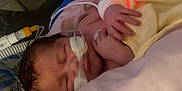 Kalel participe au concours pour gagner de l'argent avec cette photo : newborn, baby, sleeping, hospital, medical_tubes, blanket, infant, face, person, bed, healthcare, patient, pink, yellow_blanket, sleep, closeup, rest, cute, fragile, care
