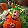 Kalel participe au concours pour gagner de l'argent avec cette photo : baby, smiling, orange_shirt, play_mat, soft_toys, hand, infant, colorful, child, indoors, cute, person, happy, lying_down, fabric, baby_toy, closeup, face, skin, young_child