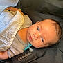 baby, babywear, blanket, blue_eyes, car_seat, child, closeup, clothing, cute, face, head, indoors, infant, newborn, pacifier, person, resting, skin, sleepy, soft_light