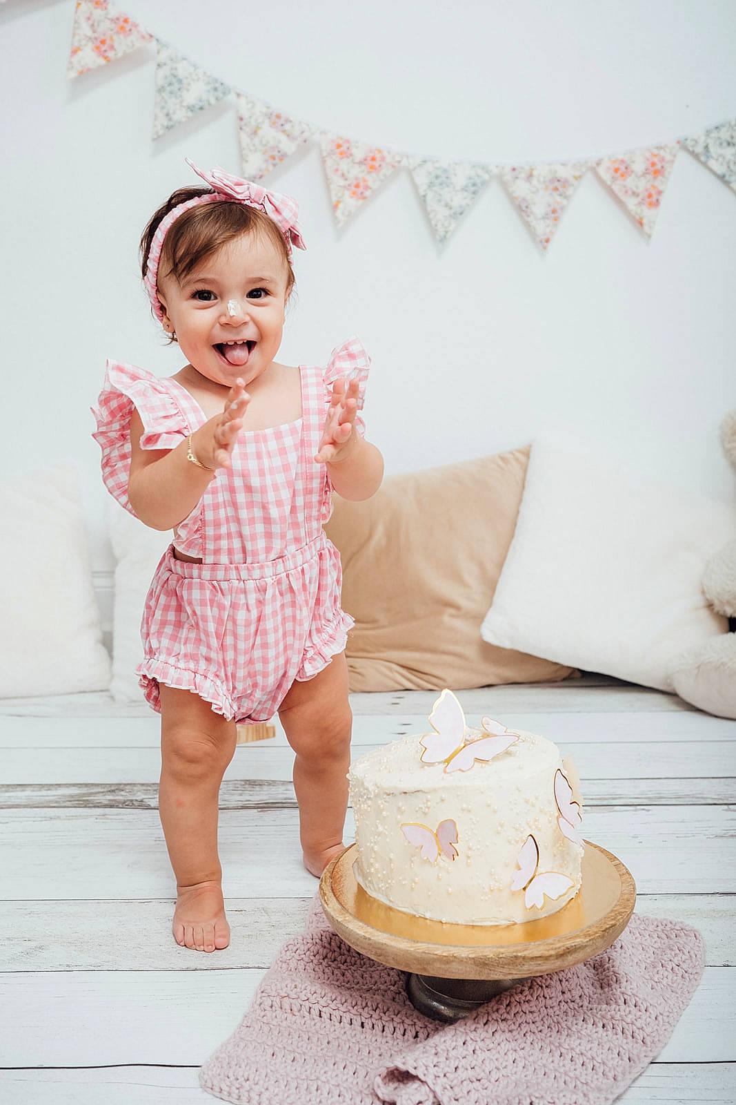 Elena participe au concours pour gagner de l'argent avec cette photo : baby, baby_toddler_clothing, cake, child, day_dress, dessert, dress, fashion_accessory, flooring, happy, joy, linens, pattern, peach, person, room, sitting, skin, sleeve, smile