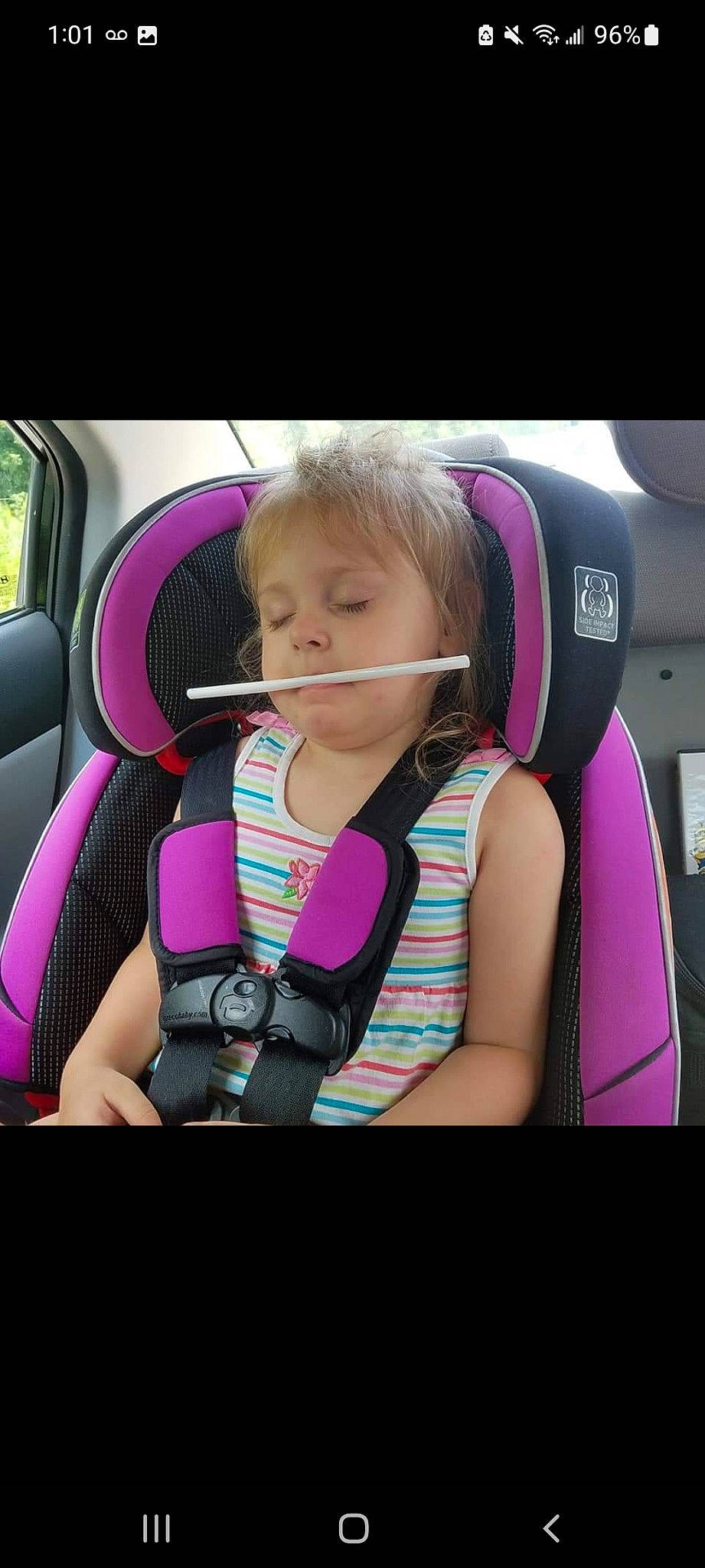 Isabella is registered to the contest to win money with this photo: audio_equipment, auto_part, automotive_design, automotive_mirror, baby_in_car_seat, car_seat, child, comfort, cool, facial_expression, happy, head_restraint, motor_vehicle, person, pink, product, seat_belt, steering_part, steering_wheel, toddler