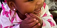 Malauni is registered to the contest to win money with this photo: toddler, child, smiling, clapping, hands, earrings, flower_pattern, pink, white_clothing, closeup, portrait, happy, cute, girl, skin, face, eyes, hair, jewelry, baby