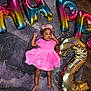 Malauni is registered to the contest to win money with this photo: toddler, child, birthday, pink_dress, tiara, balloons, number_2, floor, rug, diaper, socks, feet, celebration, indoor, happy, party, colorful, metallic, laying_down, smiling
