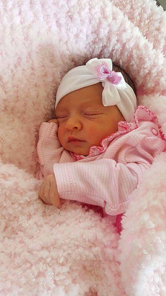 Alina is registered to the contest to win money with this photo: beauty, cheek, child, close_up, girl, hair_accessory, headwear, infant, person, petal, pink, product, skin, sleep, textile, toddler