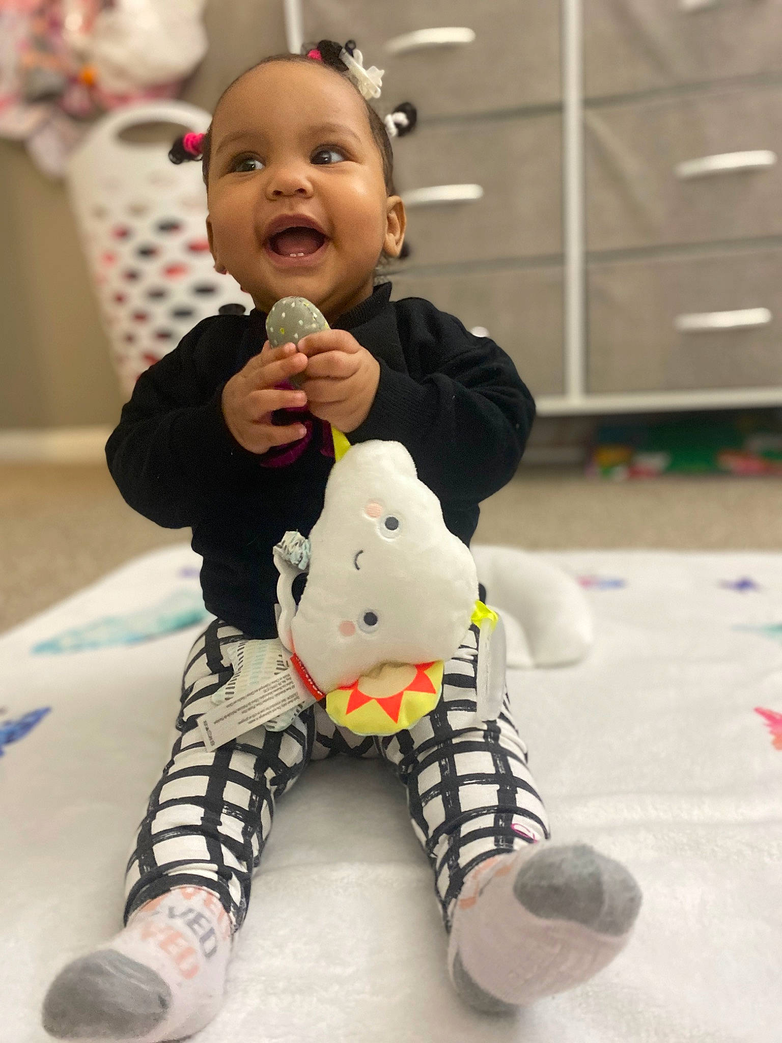 Persephone joined the competition — help win amazing prizes! baby, baby_playing_with_toys, baby_toddler_clothing, carmine, child, finger, flooring, fun, happy, head, human_leg, knee, person, sitting, skin, sleeve, smile, snapshot, thigh, toddler