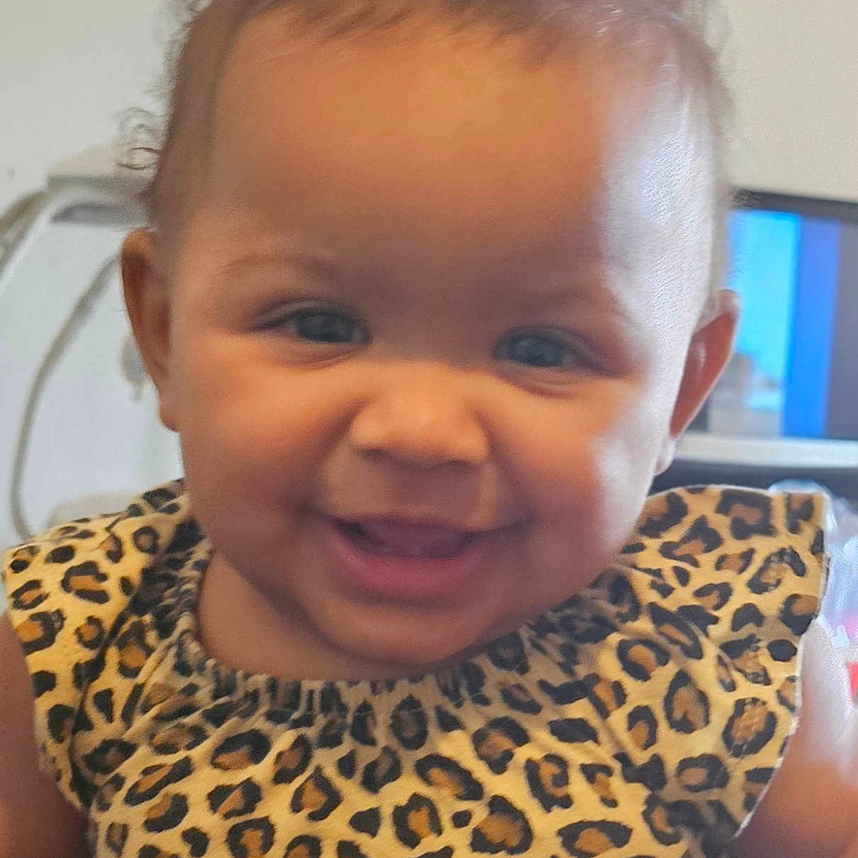 Kathryn joined the competition — help win amazing prizes! baby, child, smile, curly_hair, leopard_print, dress, portrait, indoors, cute, happy, face, person, infant, young_child, skin, eyes, cheeks, clothing, fashion, head