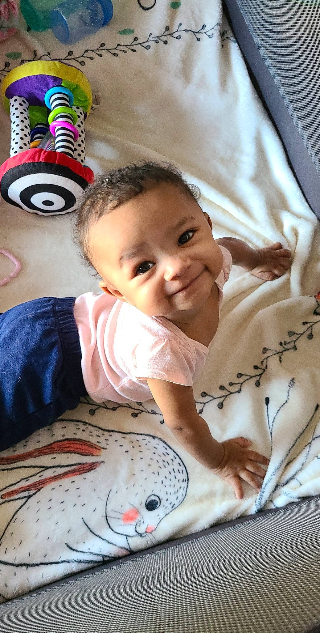 Gabriella is registered to the contest to win money with this photo: baby, baby_products, blanket, cheek, child, head, joy, leg, linens, person, play, product, skin, smile, toddler