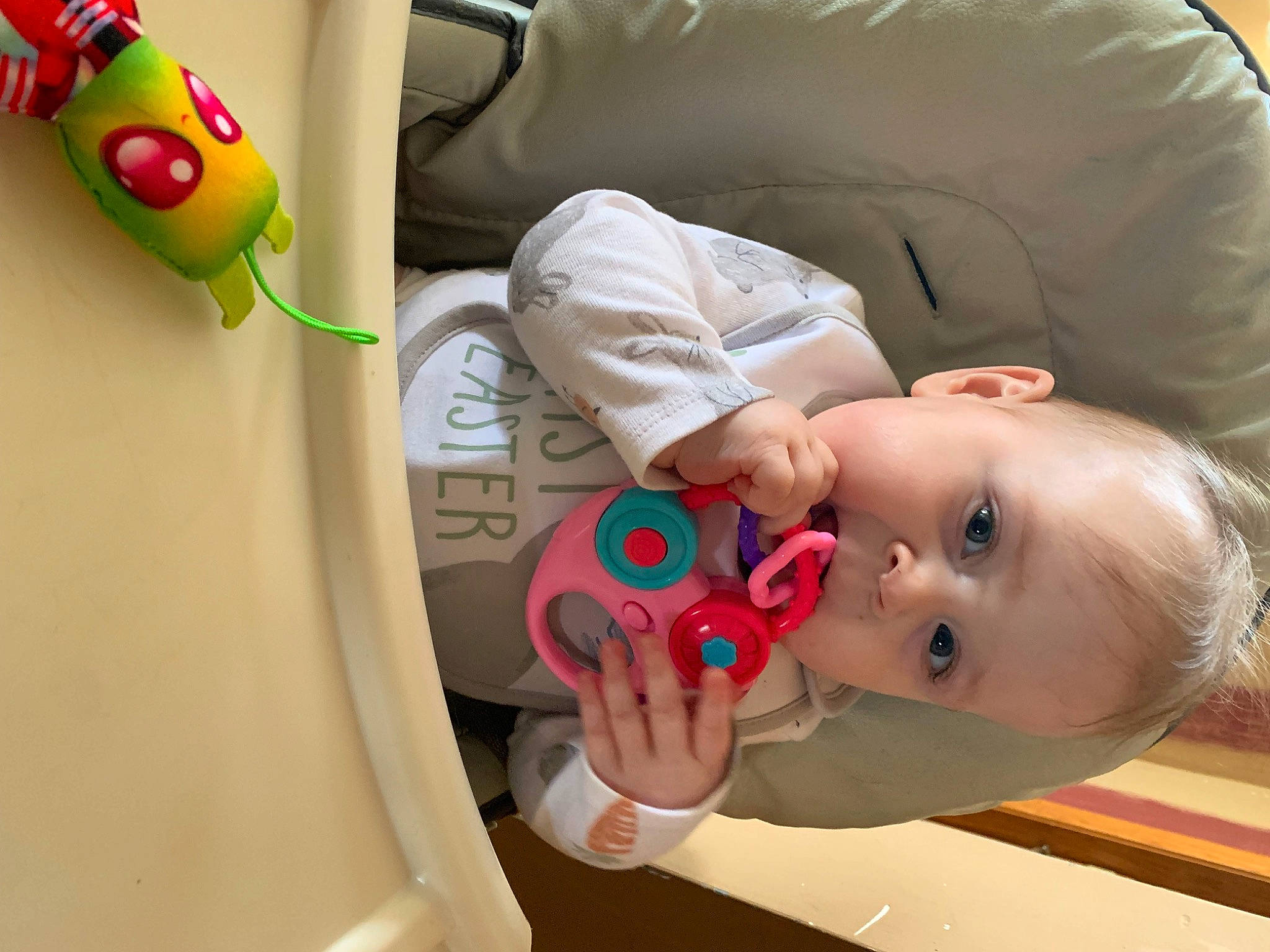 Freyja is registered to the contest to win money with this photo: baby, baby_products, baby_safety, baby_sleeping, baby_toddler_clothing, baby_toys, car_seat, child, circle, comfort, facial_expression, flooring, fun, mouth, nose, person, play, room, skin, toddler