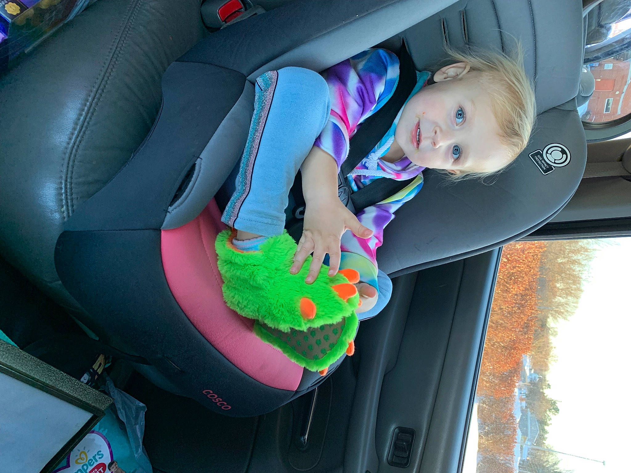 Athena is registered to the contest to win money with this photo: auto_part, automotive_design, automotive_exterior, automotive_wheel_system, car, car_seat, car_seat_cover, child, family_car, fun, leisure, luxury_vehicle, mode_of_transport, motor_vehicle, person, plant, smile, steering_wheel, toddler, vehicle