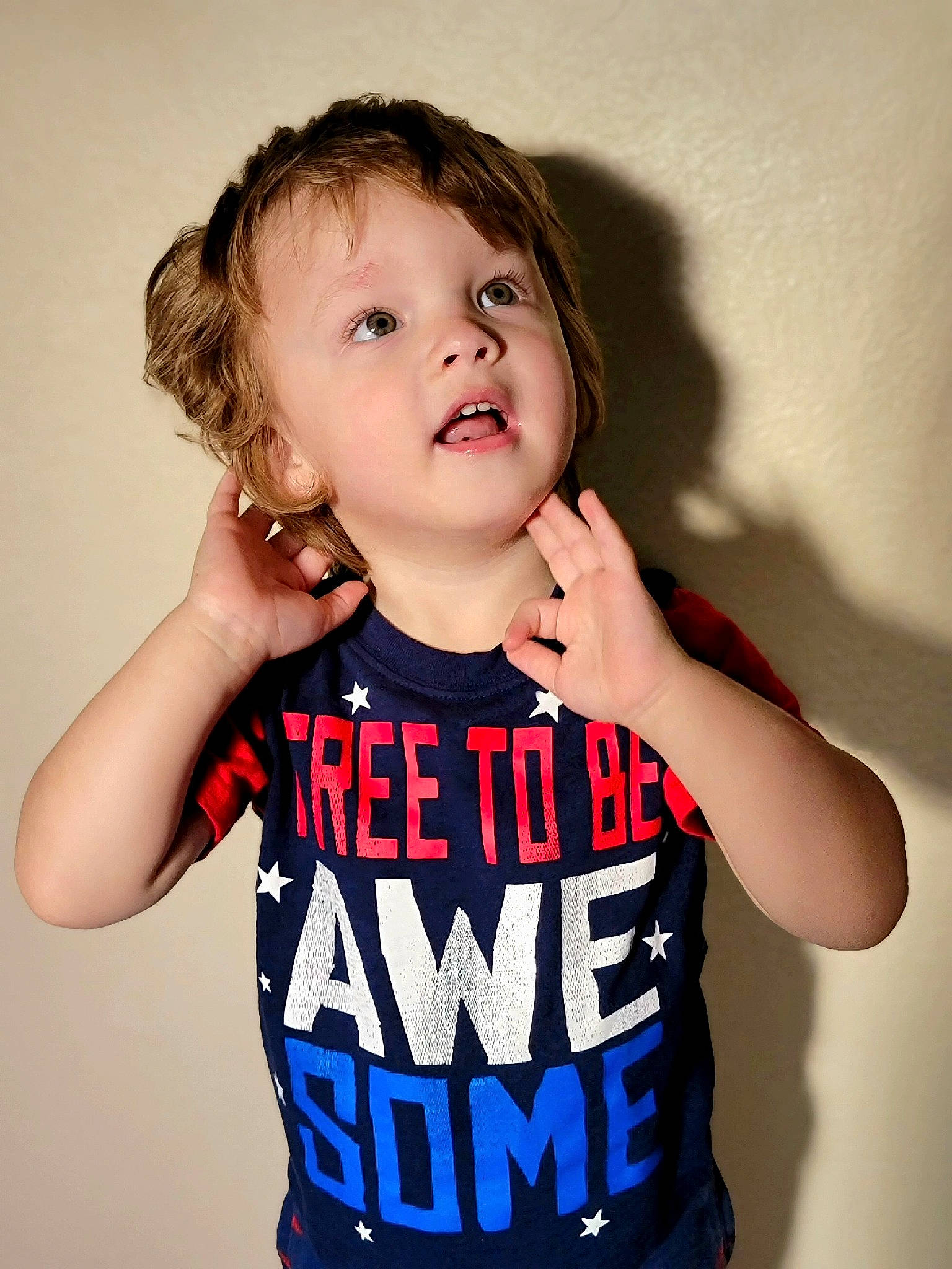 Daylin is registered to the contest to win money with this photo: baby_toddler_clothing, cheek, chin, elbow, eye, eyelash, face, finger, flash_photography, gesture, hair, hand, happy, head, neck, person, shoulder, sleeve, t_shirt, thumb
