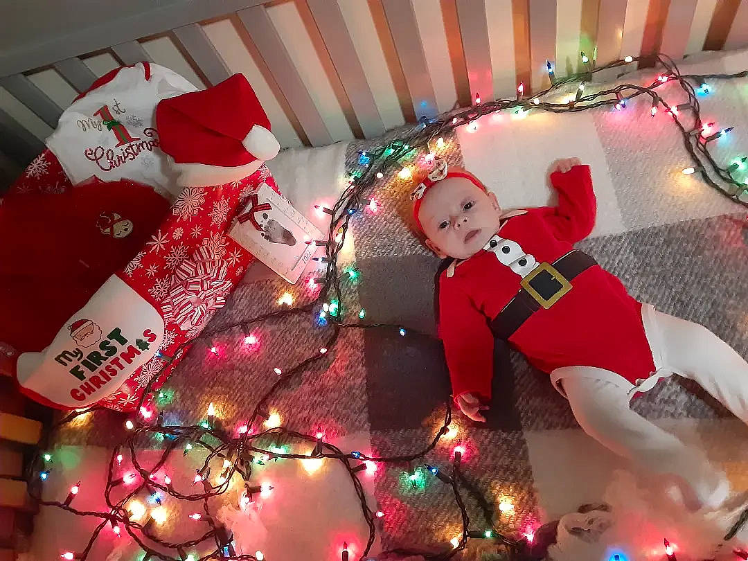 Azariah is registered to the contest to win money with this photo: carmine, christmas, christmas_decoration, christmas_eve, christmas_lights, christmas_ornament, decoration, entertainment, event, fictional_character, fun, headwear, holiday, holiday_ornament, interior_design, light, ornament, party_supply, person, santa_claus