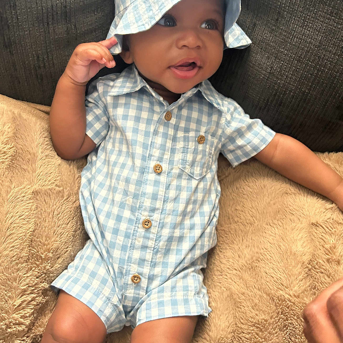Knolyn joined the competition — help win amazing prizes! baby, blue_checkered, child, clothing, comfortable, couch, cute, hand, happy, hat, indoors, infant, legs, one_piece, plush_cushion, portrait, seated, shirt, skin, smiling