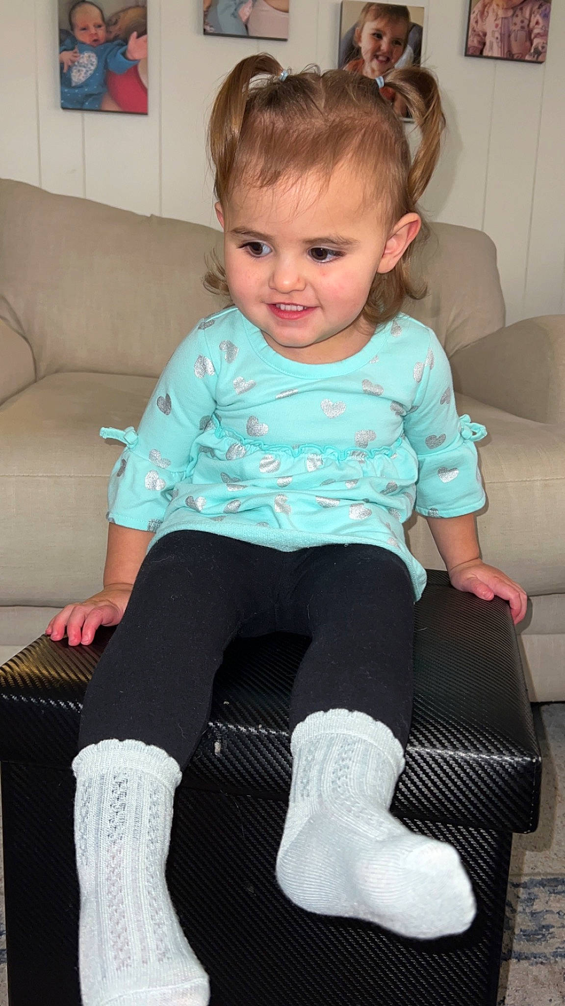 Bexlie is registered to the contest to win money with this photo: baby_toddler_clothing, blue, child, comfort, couch, face, hair, head, human_leg, joint, joy, knee, leg, person, pink, sleeve, sock, sportswear, t_shirt, thigh