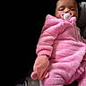 Zsamiya joined the competition — help win amazing prizes! baby, infant, pink_onesie, pacifier, mittens, sleeping, cozy, child, person, cute, soft_clothing, portrait, indoor, black_background, toddler, cuddly, resting, newborn, handwear, warm_clothing