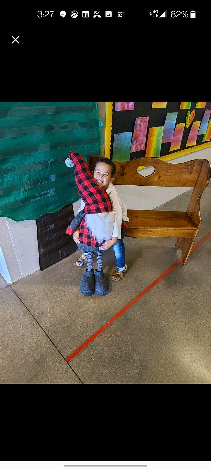 Kobe is registered to the contest to win money with this photo: art, bench, boot, cart, chair, child, floor, flooring, fun, leisure, magenta, pattern, person, play, recreation, room, sitting, toddler, toy, visual_arts