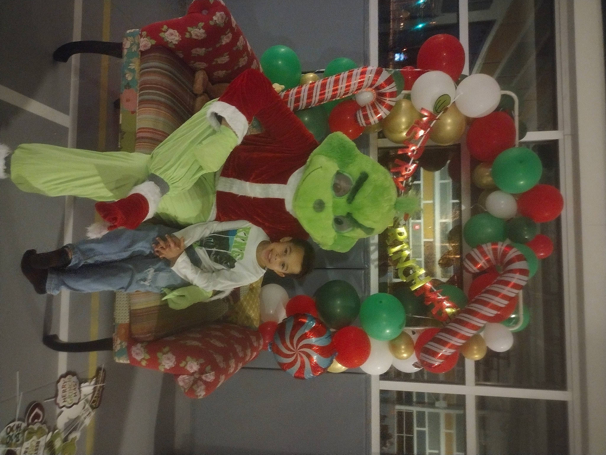 Kobe is registered to the contest to win money with this photo: balloon, chair, circle, decoration, event, fun, glass, hat, holiday, interior_design, joy, lighting_accessory, ornament, party_supply, person, plastic, room, table, tree, window