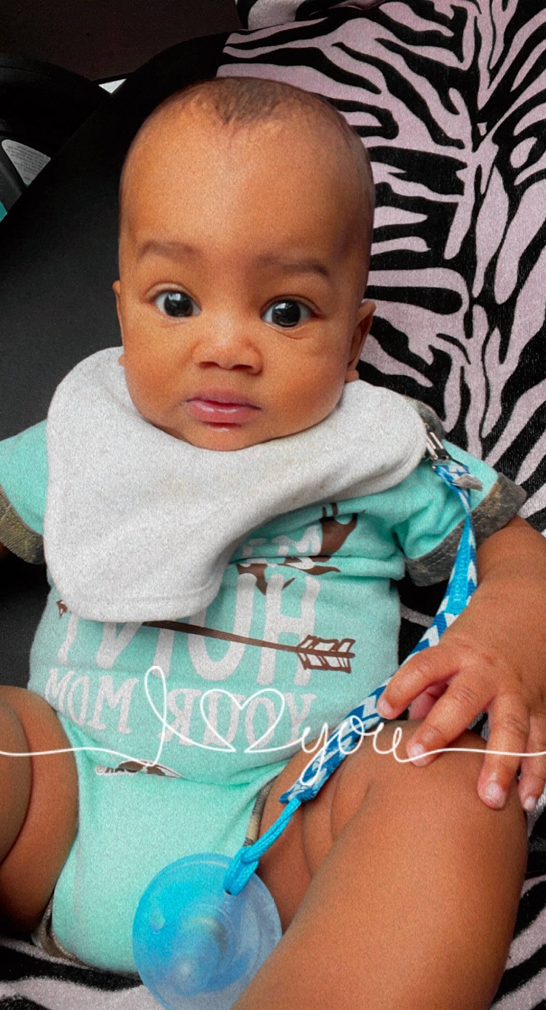 Jamarrion is registered to the contest to win money with this photo: arm, azure, baby_toddler_clothing, cheek, chin, eye, eyebrow, facial_expression, gesture, head, joint, lip, mammal, mouth, neck, nose, organ, person, product, skin