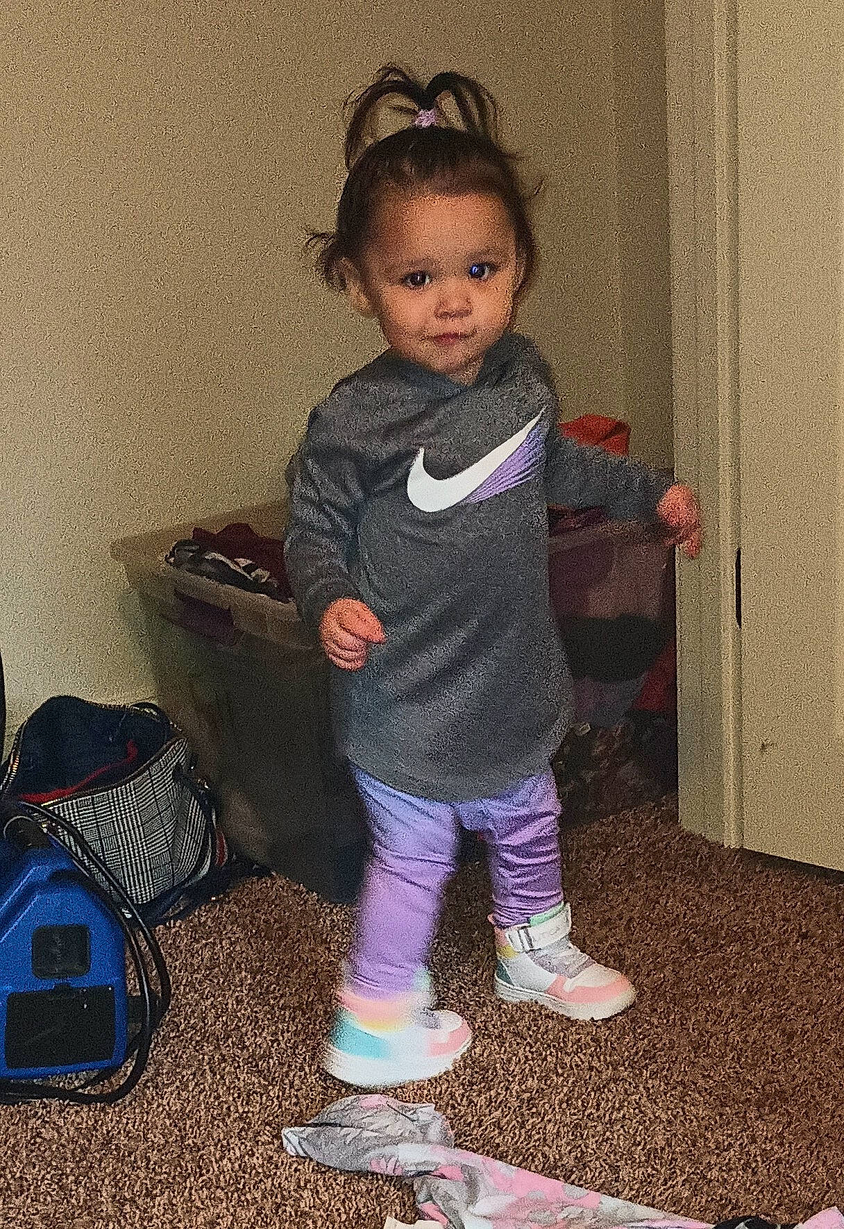 Makayla is registered to the contest to win money with this photo: baby_toddler_clothing, backpack, bag, boot, child, eye, fun, human_leg, iris, knee, leggings, luggage_and_bags, pattern, person, play, room, shoulder, sitting, sleeve, sock