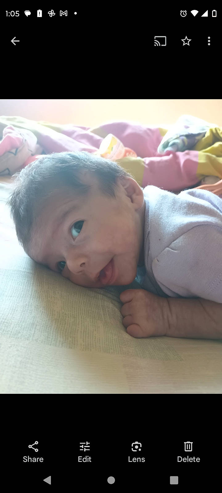 Mya is registered to the contest to win money with this photo: baby, baby_toddler_clothing, cheek, child, chin, comfort, eyebrow, eyelash, flooring, forehead, grass, happy, hardwood, linens, lip, nose, person, skin, smile, toddler