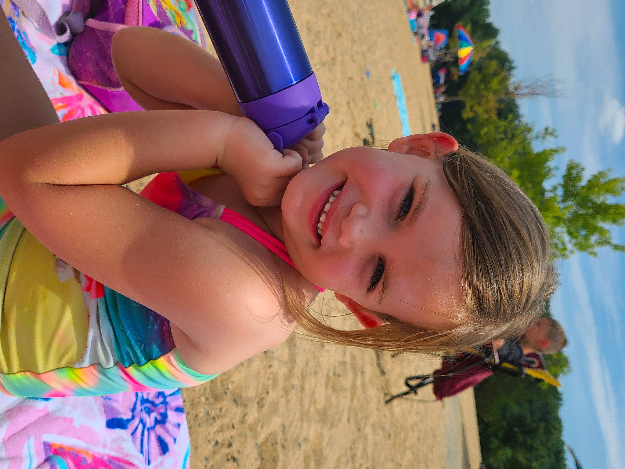 Lilian is registered to the contest to win money with this photo: beach, blue, child, fun, grass, happy, joy, leisure, light, people_in_nature, people_on_beach, person, play, recreation, sand, skin, sky, smile, summer, swimwear