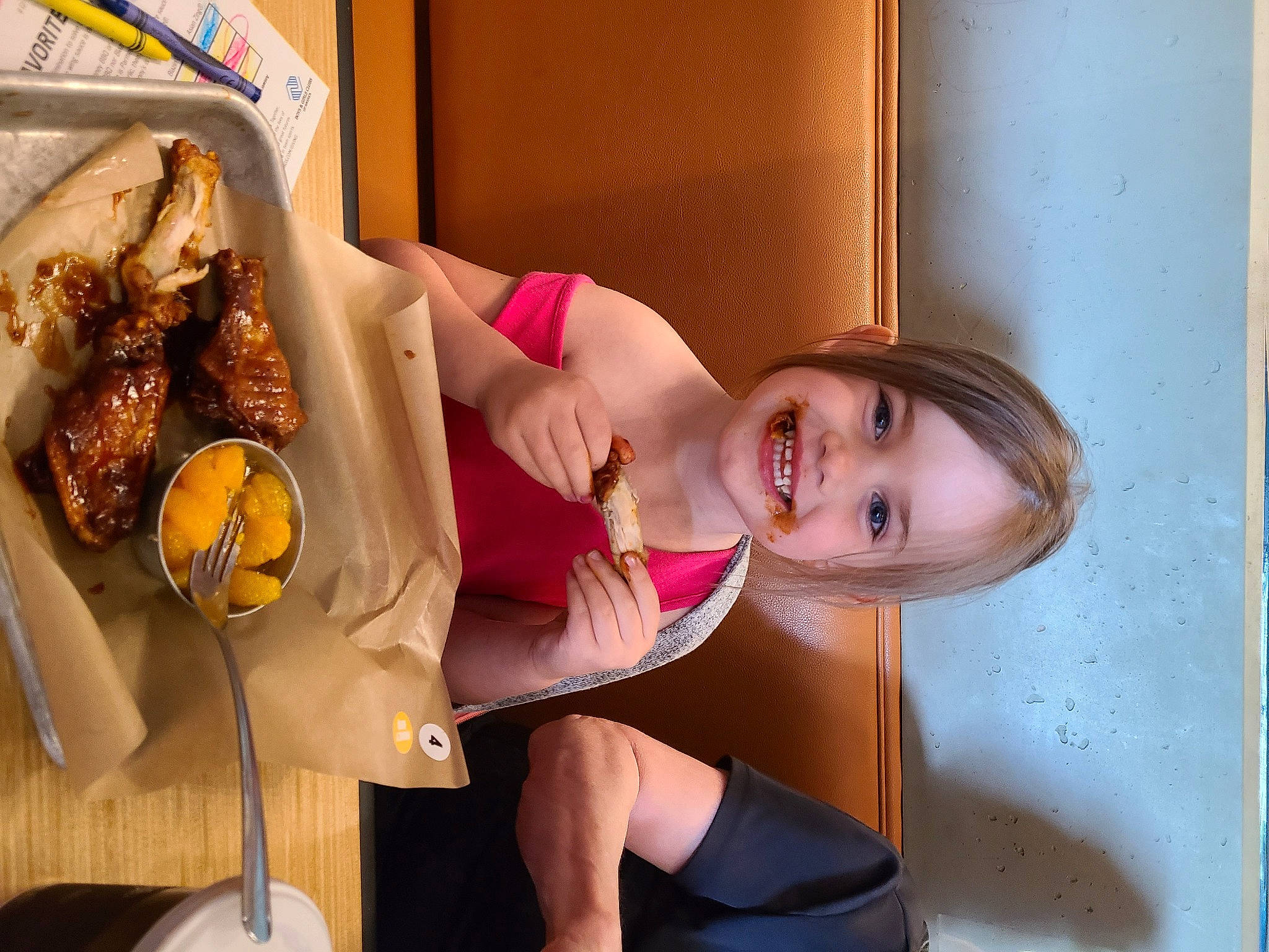 Lilian is registered to the contest to win money with this photo: abdomen, bread, chair, chest, comfort_food, dress, fast_food, finger_food, food, happy, human_leg, ingredient, joy, junk_food, kitchen, knee, major_appliance, person, room, smile