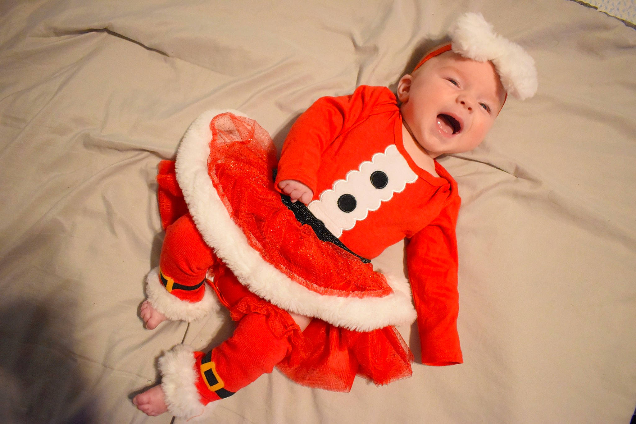 Addalynn is registered to the contest to win money with this photo: baby, baby_toddler_clothing, carmine, child, collar, comfort, coquelicot, fun, fur, happy, headwear, linens, orange, pattern, peach, person, room, sleeve, toddler, winter