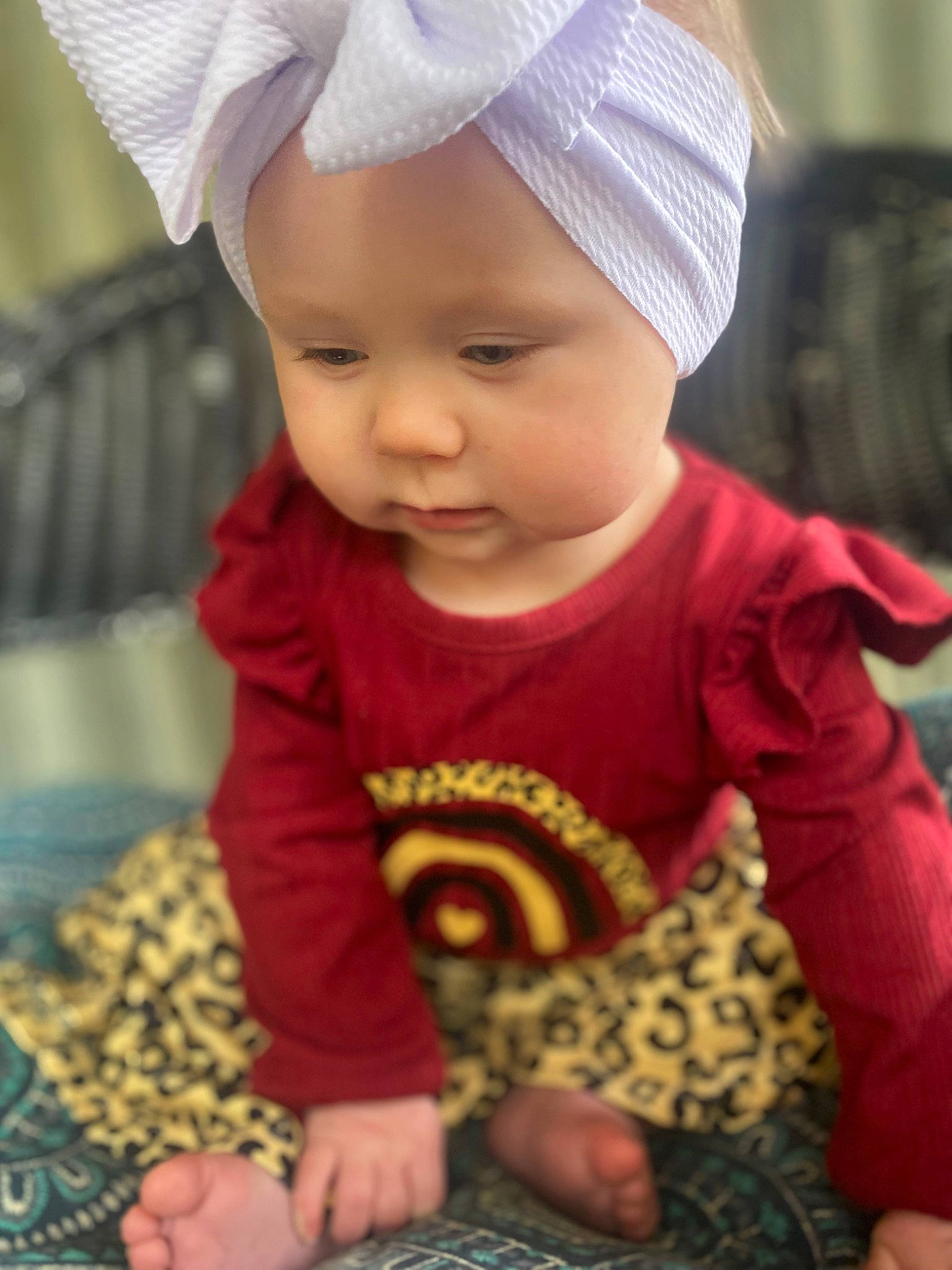 Leanne joined the competition — help win amazing prizes! baby, baby_toddler_clothing, beanie, cap, cheek, child, fashion_accessory, happy, head, headwear, knit_cap, magenta, pattern, person, photograph, pink, product, sitting, skin, sleeve