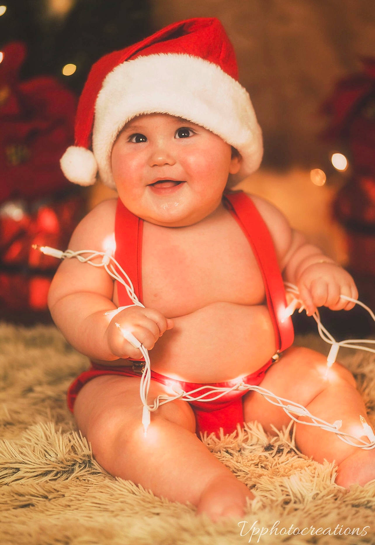 Gianni joined the competition — help win amazing prizes! baby, baby_toddler_clothing, cap, child, christmas, dress, event, fun, grass, happy, hat, headgear, headwear, holiday, person, pink, santa_claus, sitting, skin, smile