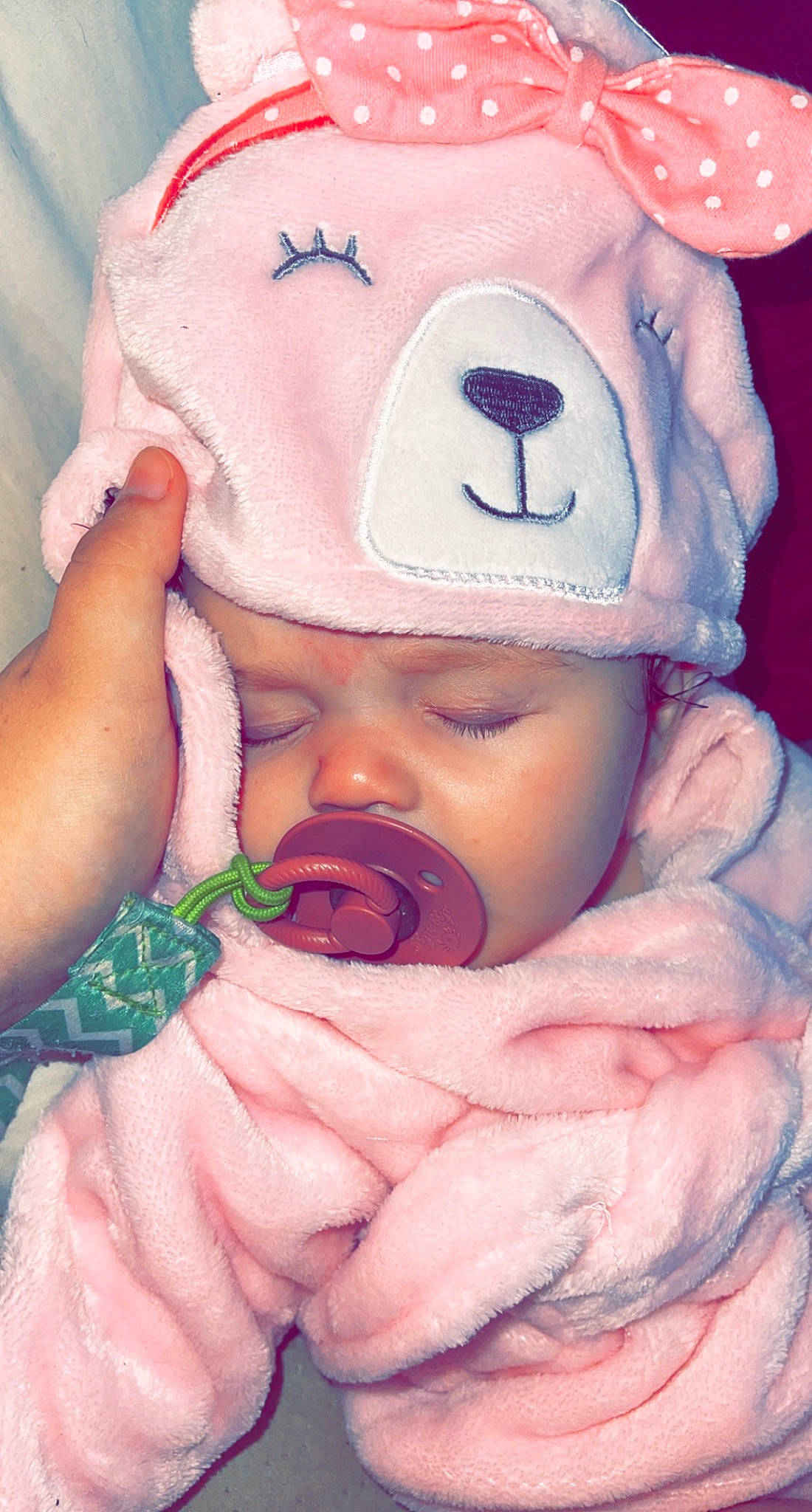 Maggie is registered to the contest to win money with this photo: baby, baby_products, baby_sleeping, baby_toddler_clothing, cap, carmine, cheek, child, happy, headwear, linens, lip, mouth, nail, nose, person, pink, skin, textile, thumb