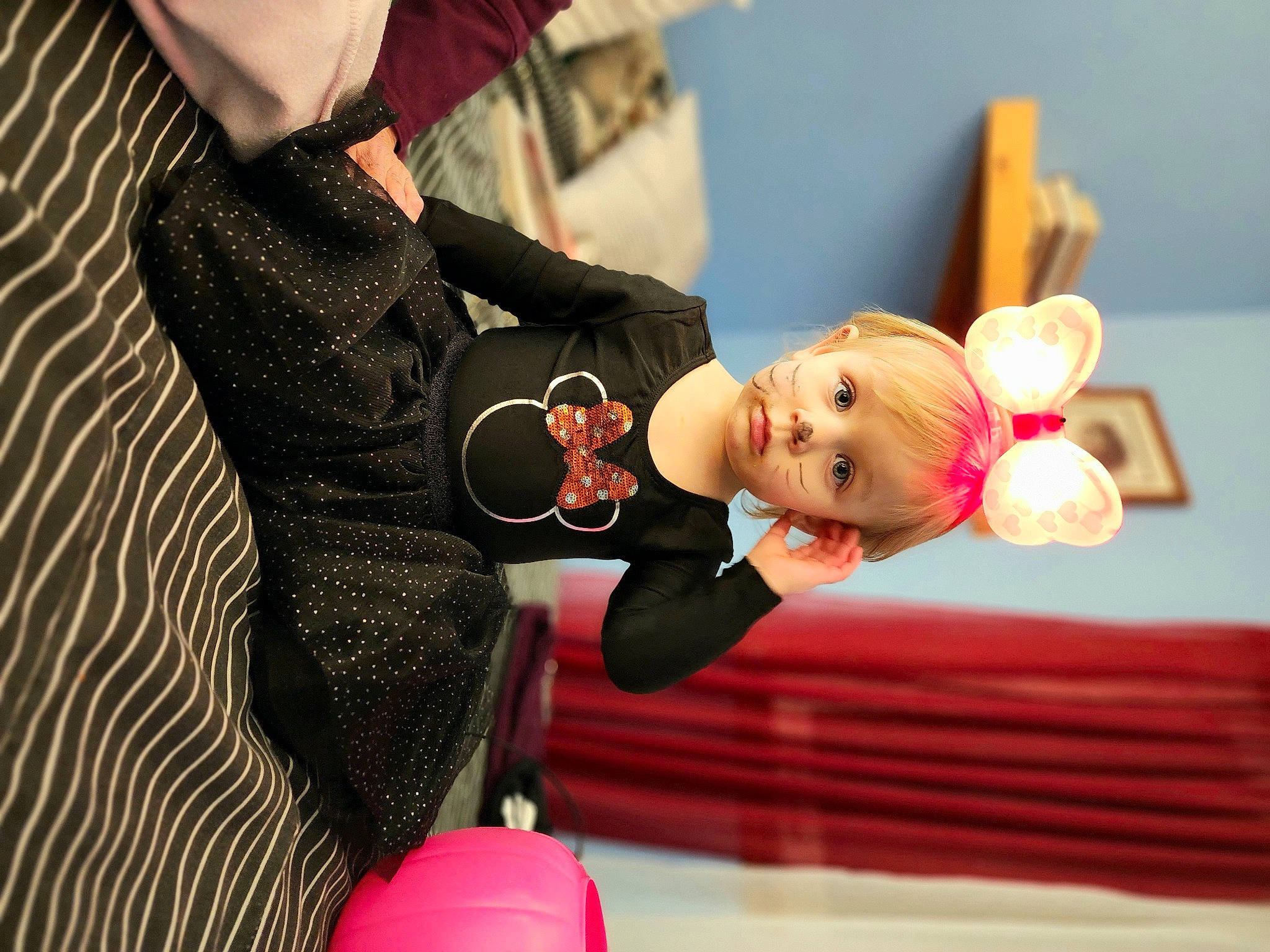 Leana is registered to the contest to win money with this photo: child, doll, dress, entertainment, event, figurine, formal_wear, fun, gesture, happy, human_body, joint, performance, performing_arts, person, room, sitting, stuffed_toy, suit, toddler