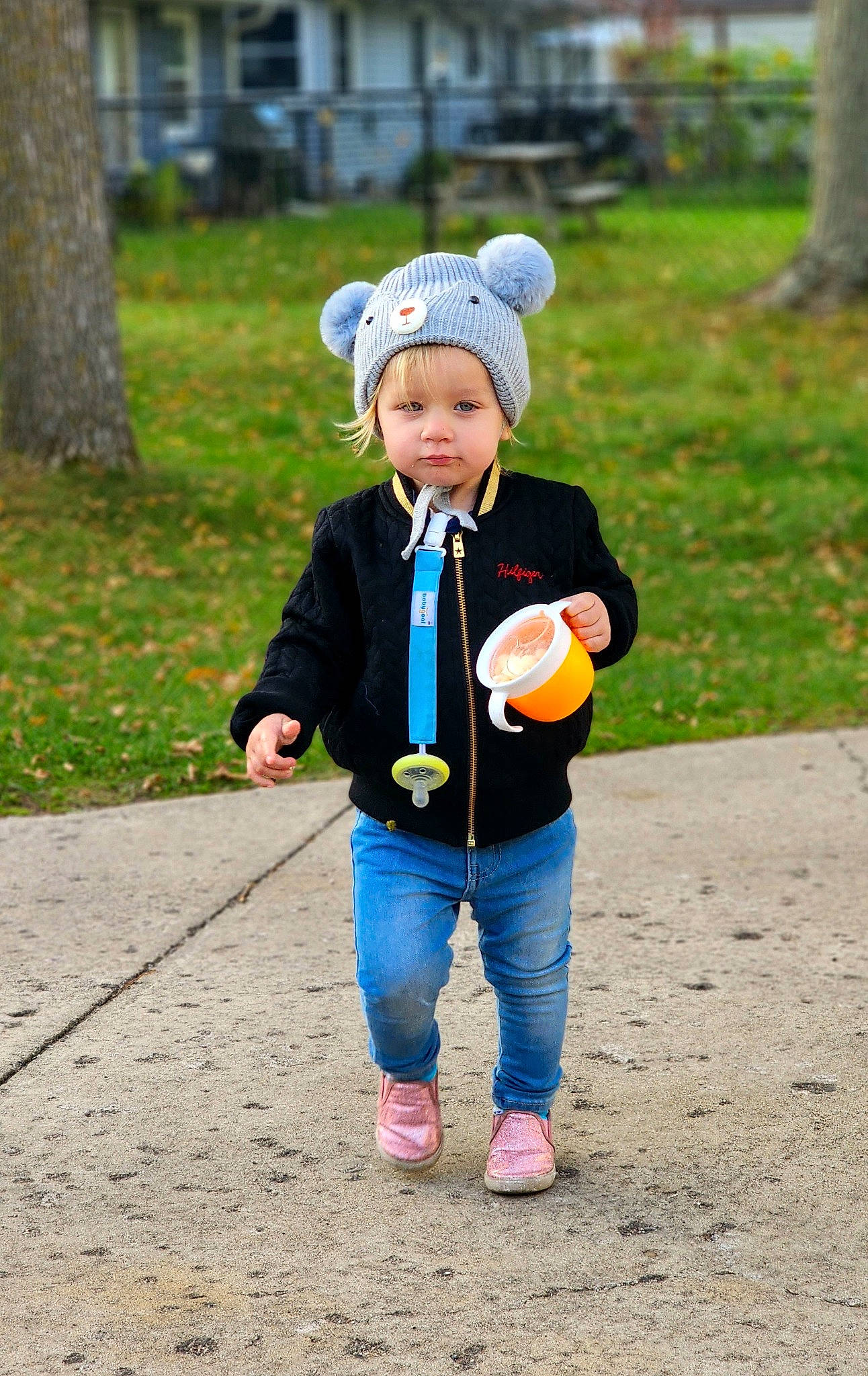 Leana is registered to the contest to win money with this photo: baby, ball, child, fashion_accessory, fun, grass, happy, hat, headwear, leisure, people_in_nature, person, plant, play, recreation, sitting, sneakers, sports_equipment, toddler, toy