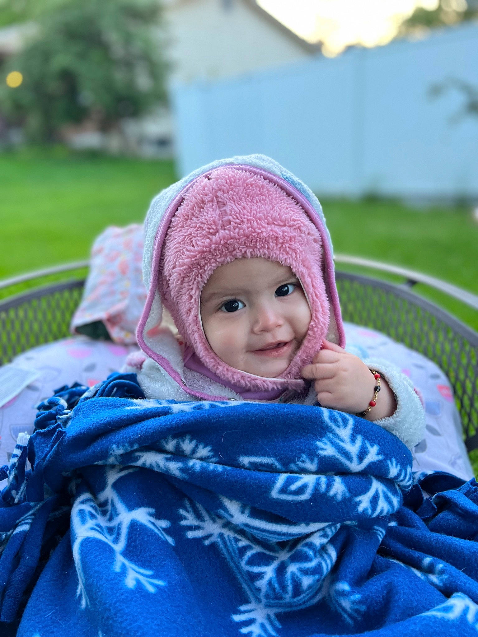 Esmeralda joined the competition — help win amazing prizes! blue, cap, child, electric_blue, fashion_accessory, fun, grass, green, happy, headwear, leisure, magenta, people_in_nature, person, plant, recreation, sitting, smile, textile, toddler