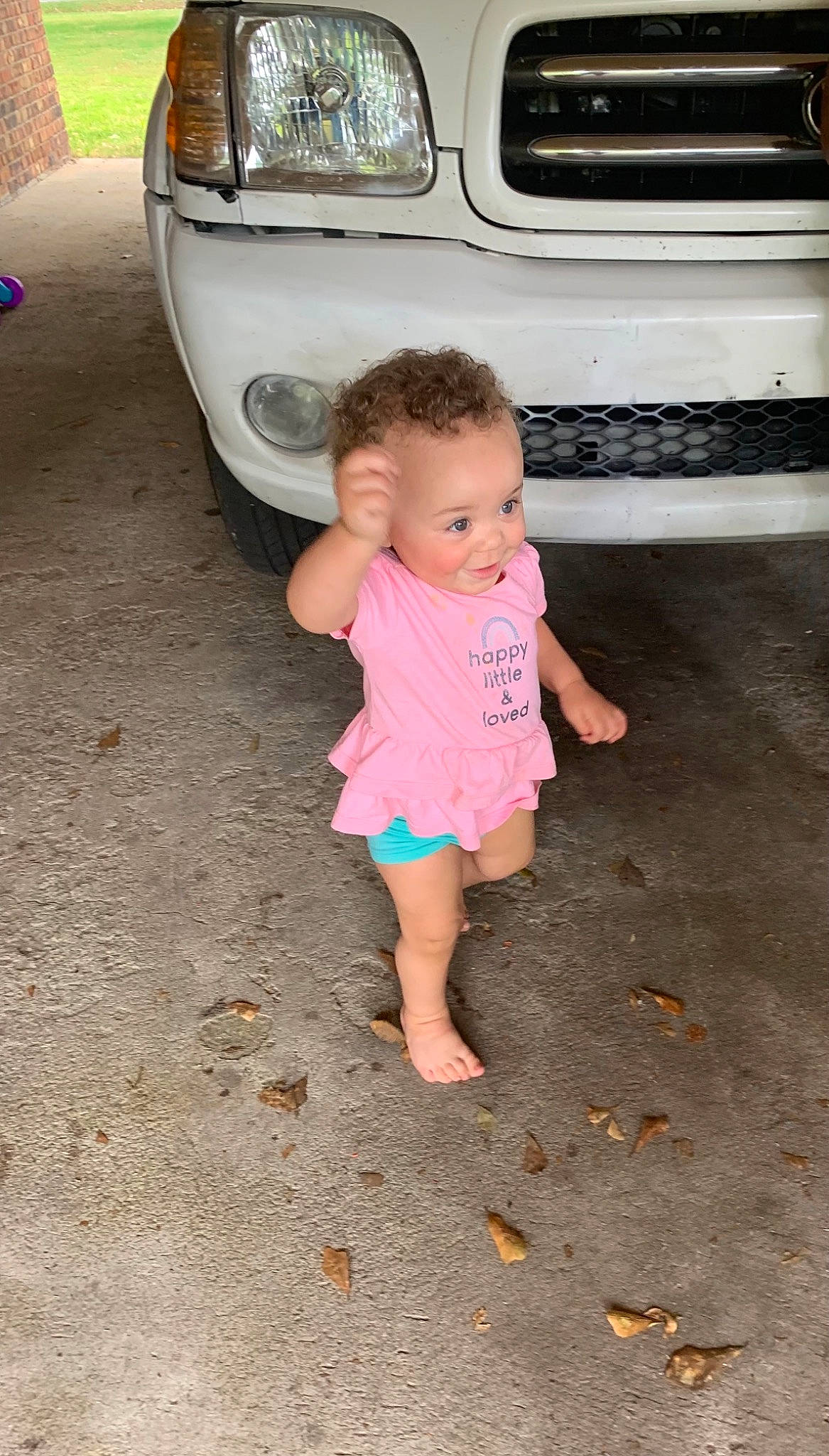 Brinleigh is registered to the contest to win money with this photo: automotive_exterior, automotive_lighting, automotive_tire, baby_toddler_clothing, bumper, car, hair, hand, hood, leg, mammal, motor_vehicle, person, pink, skin, summer, tire, toddler, vehicle, vehicle_door