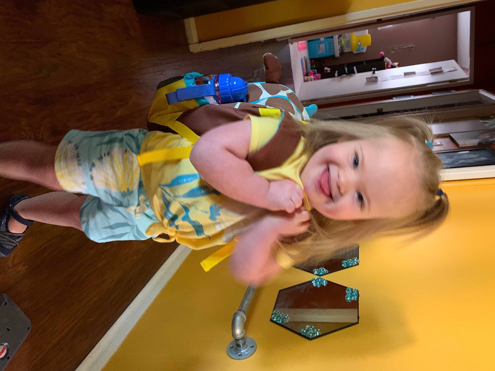 Penelope is registered to the contest to win money with this photo: baby_toddler_clothing, child, floor, flooring, fun, hand, happy, hardwood, home_appliance, human_leg, joint, joy, kitchen_appliance, leisure, microwave_oven, person, play, smile, t_shirt, thigh