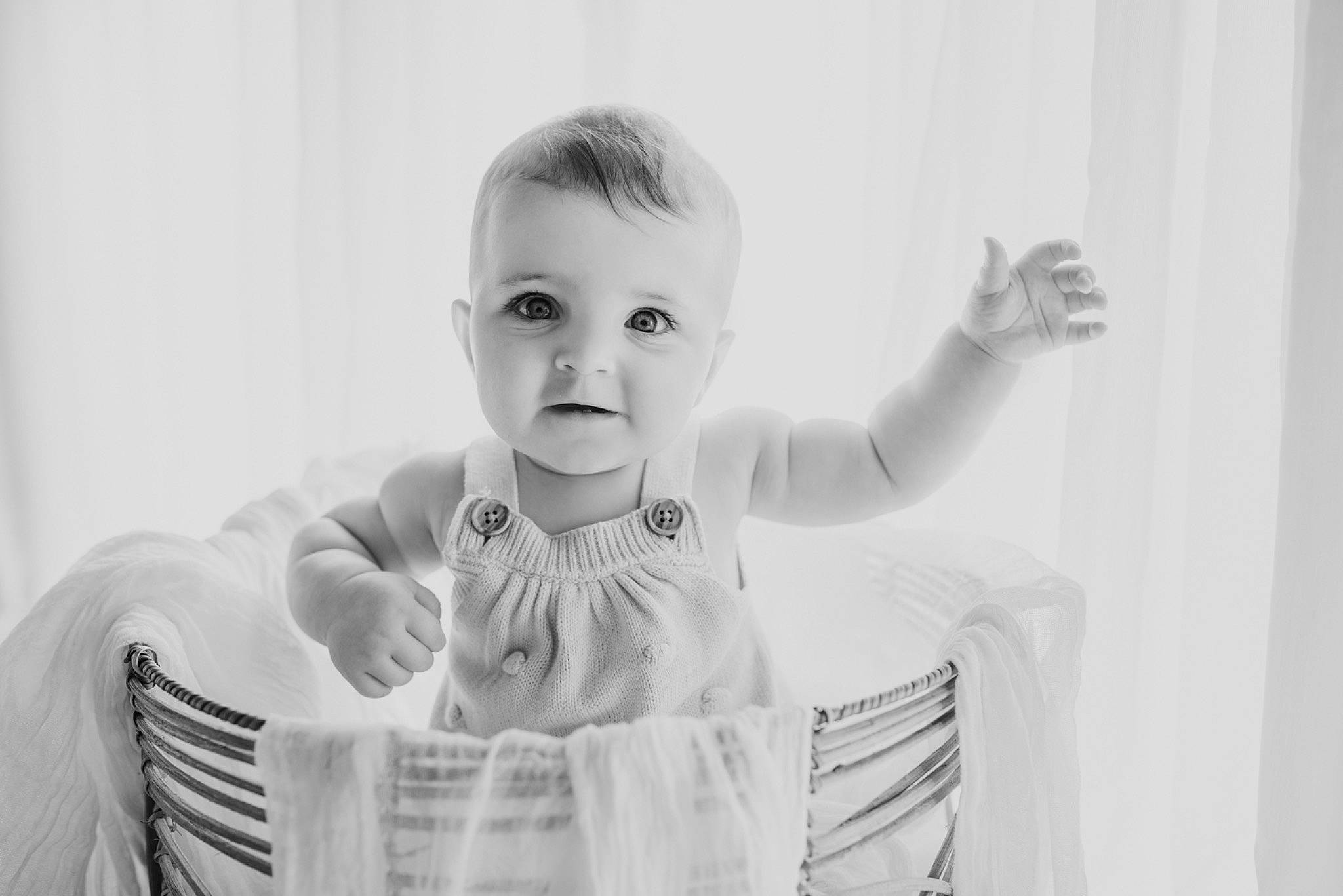 Scout is registered to the contest to win money with this photo: baby, baby_toddler_clothing, black_and_white, child, comfort, elbow, eyelash, flash_photography, fun, gesture, happy, laugh, monochrome, monochrome_photography, person, sitting, sleeve, smile, stock_photography, t_shirt