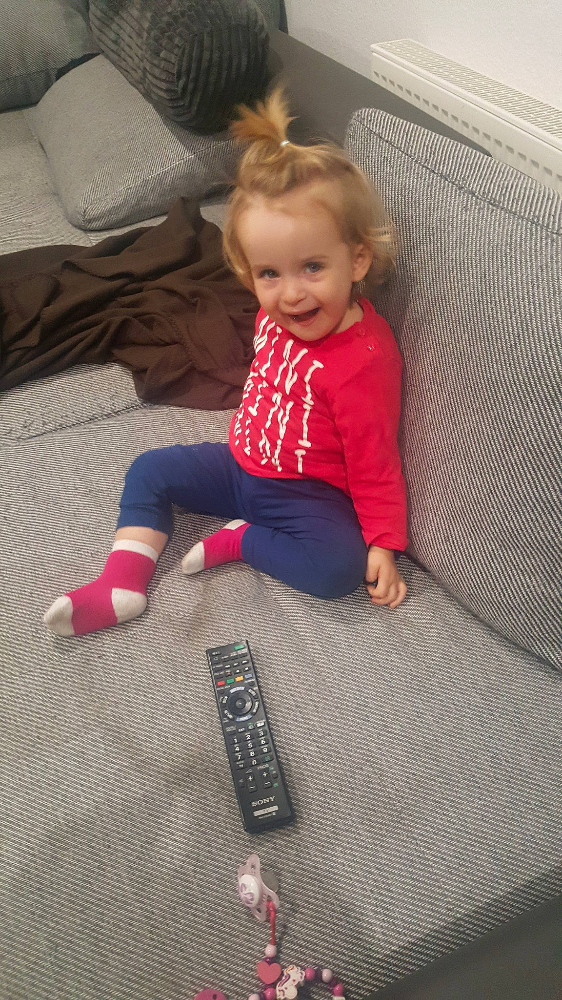 Eléna participe au concours pour gagner de l'argent avec cette photo : child, day, floor, flooring, fun, girl, infant, joy, leg, pattern, person, pink, play, product, red, sitting, skin, standing, textile, toddler