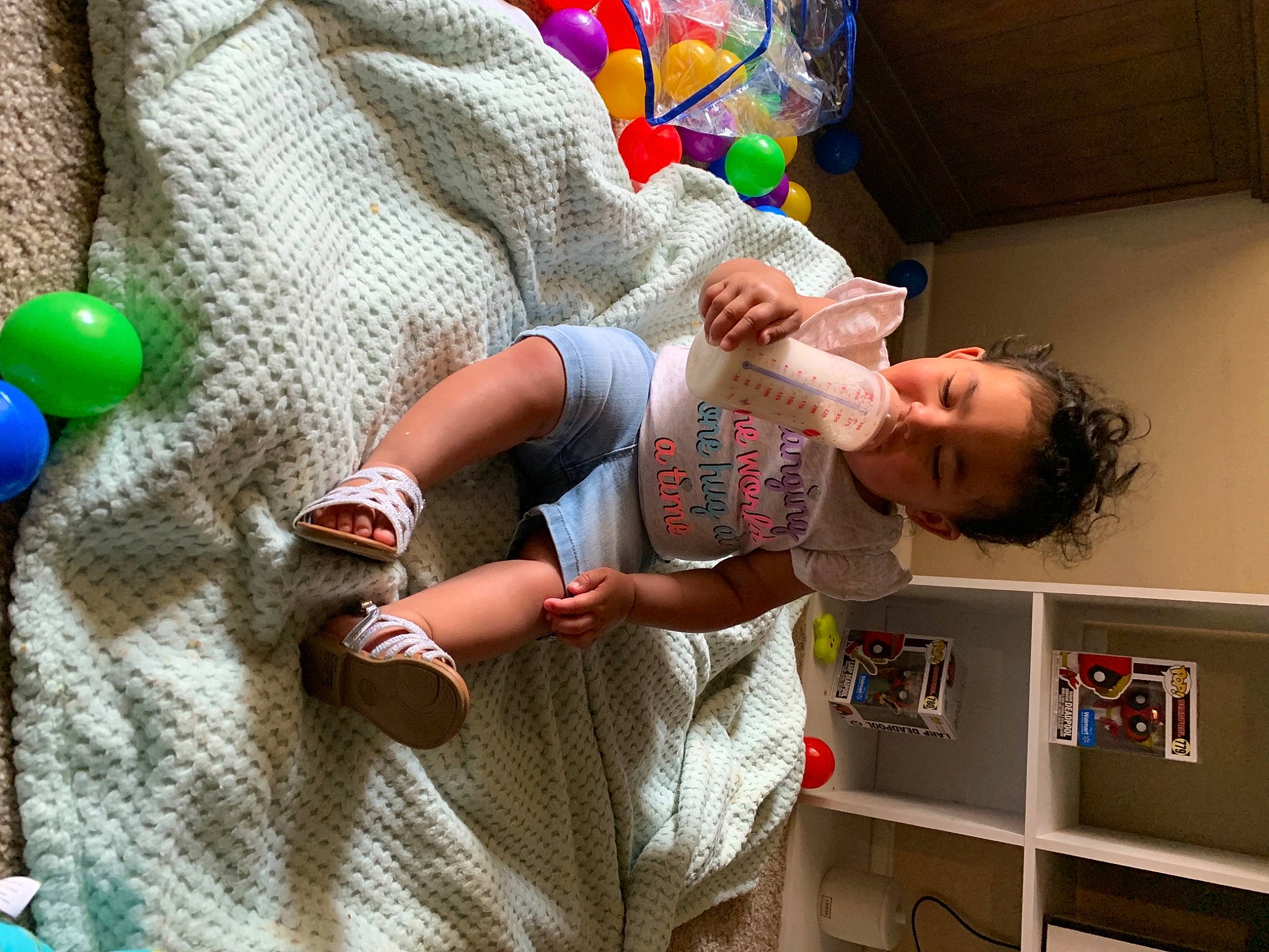 Dolores joined the competition — help win amazing prizes! baby, baby_products, baby_toys, balloon, bookcase, child, comfort, fun, green, hand, leisure, linens, party_supply, pattern, person, play, room, shelf, t_shirt, toddler