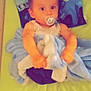 baby, pacifier, blanket, bed, pillow, paw_patrol, child, indoor, cute, infant, sleeping_area, toy_theme, comfort, person, young_child, nursery, soft_toy, wrapped, lying_down, colorful