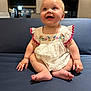 Freya joined the competition — help win amazing prizes! baby, child, smiling, sitting, dress, embroidered_clothing, blue_couch, happy, indoor, infant, cute, person, skin, face, hand, foot, window, furniture, light, expression