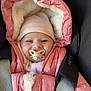 Manon a rejoint le concours — aidez-le/la à gagner de superbes lots ! baby, pacifier, pink_jacket, hat, car_seat, child, winter_clothing, fur_lining, seatbelt, cute, infant, portrait, warm, smiling_eyes, cozy, indoor, closeup, face, small_child, adorable