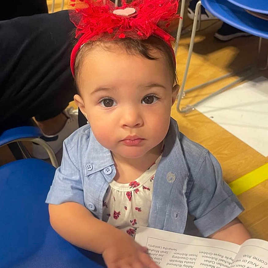 Samantha joined the competition — help win amazing prizes! accessories, baby, bodypart, clothing, crawling, face, hair, head, pen, people, person, photobombing, photography, portrait, reading, shoulder, sitting, sleeve, student, text