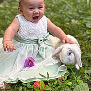 Mavis joined the competition — help win amazing prizes! baby, child, infant, smiling, happy, portrait, outdoor, garden, nature, grass, greenery, dress, white_dress, mint_green, hair_bow, earrings, rabbit, bunny, floppy_ears, flower