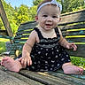 Mavis joined the competition — help win amazing prizes! baby, child, infant, smiling, outdoor, garden, swing, wooden_bench, barefoot, dress, black_dress, headband, bow, portrait, sitting, happy, face, summer, trees, sunlight