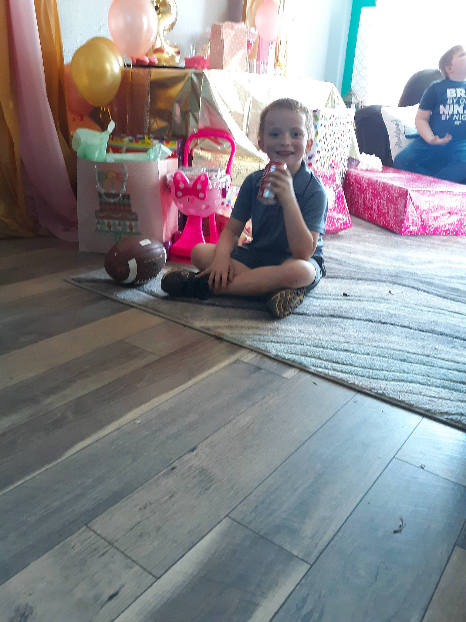 Kyle is registered to the contest to win money with this photo: child, floor, flooring, hardwood, joy, leg, leisure, magenta, person, pink, play, sitting, snapshot, temple, toddler, vacation, wood
