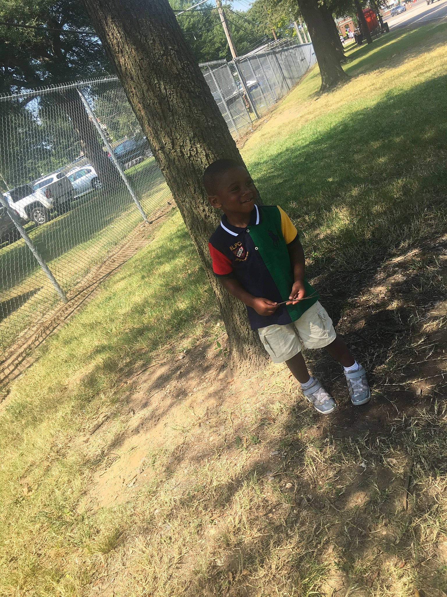 Gary is registered to the contest to win money with this photo: grass, joy, lawn, leisure, outdoor_play_equipment, person, plant, swing, tree, woody_plant