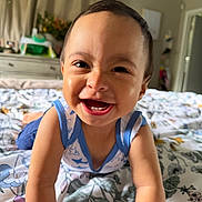 Jonathan is registered to the contest to win money with this photo: toddler, child, smiling, happy, bed, blanket, indoor, portrait, face, person, clothing, sleeveless, baby, cute, expression, home, furniture, curtains, room, skin