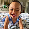 toddler, child, smiling, happy, bed, blanket, indoor, portrait, face, person, clothing, sleeveless, baby, cute, expression, home, furniture, curtains, room, skin