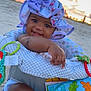 baby, child, hat, butterfly, beach, sunset, sand, toy, blanket, cushion, colorful, smile, cute, infant, outdoor, happy, person, seat, play, nature